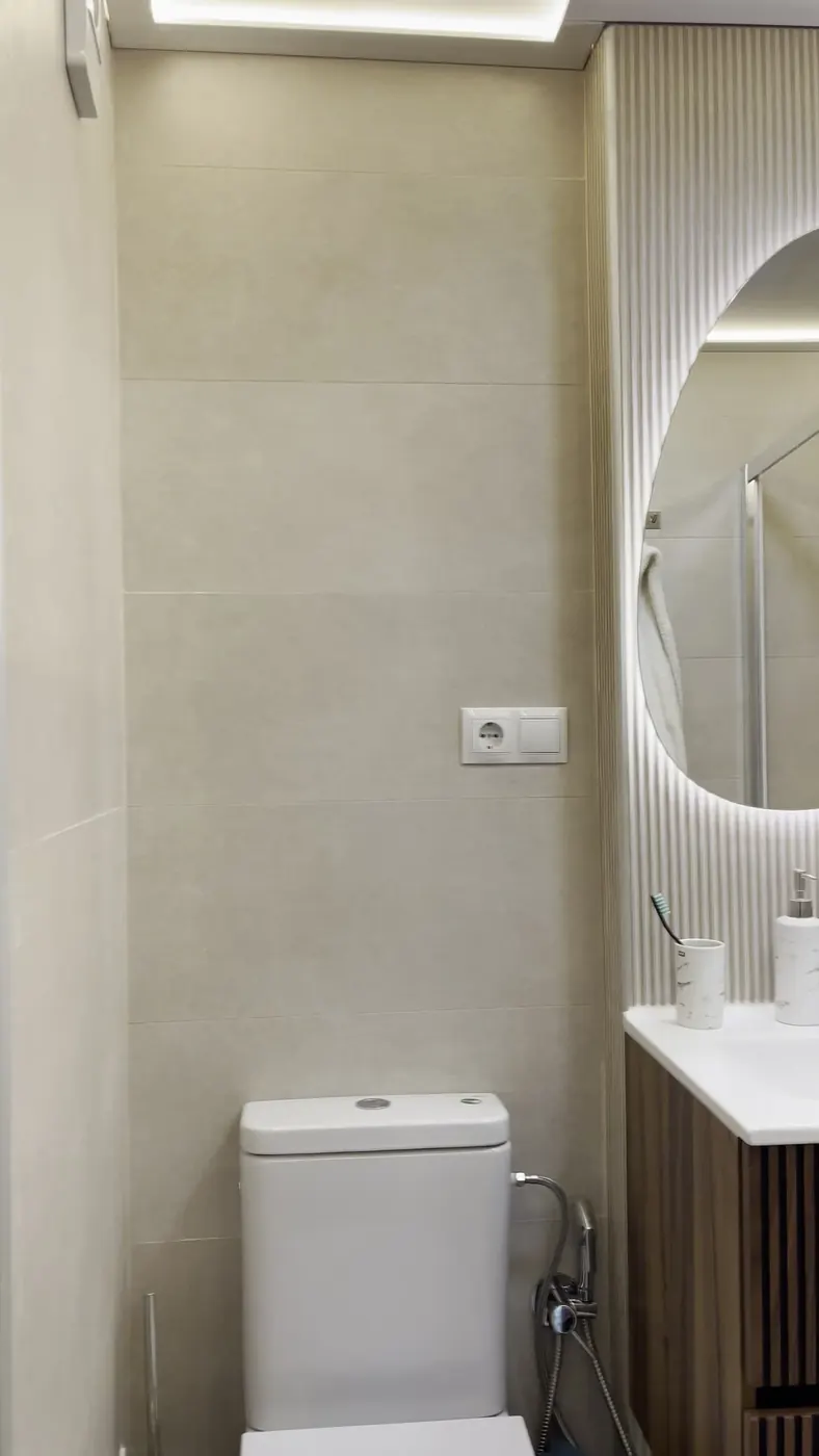 Mueble de lavabo y espejo retroiluminado